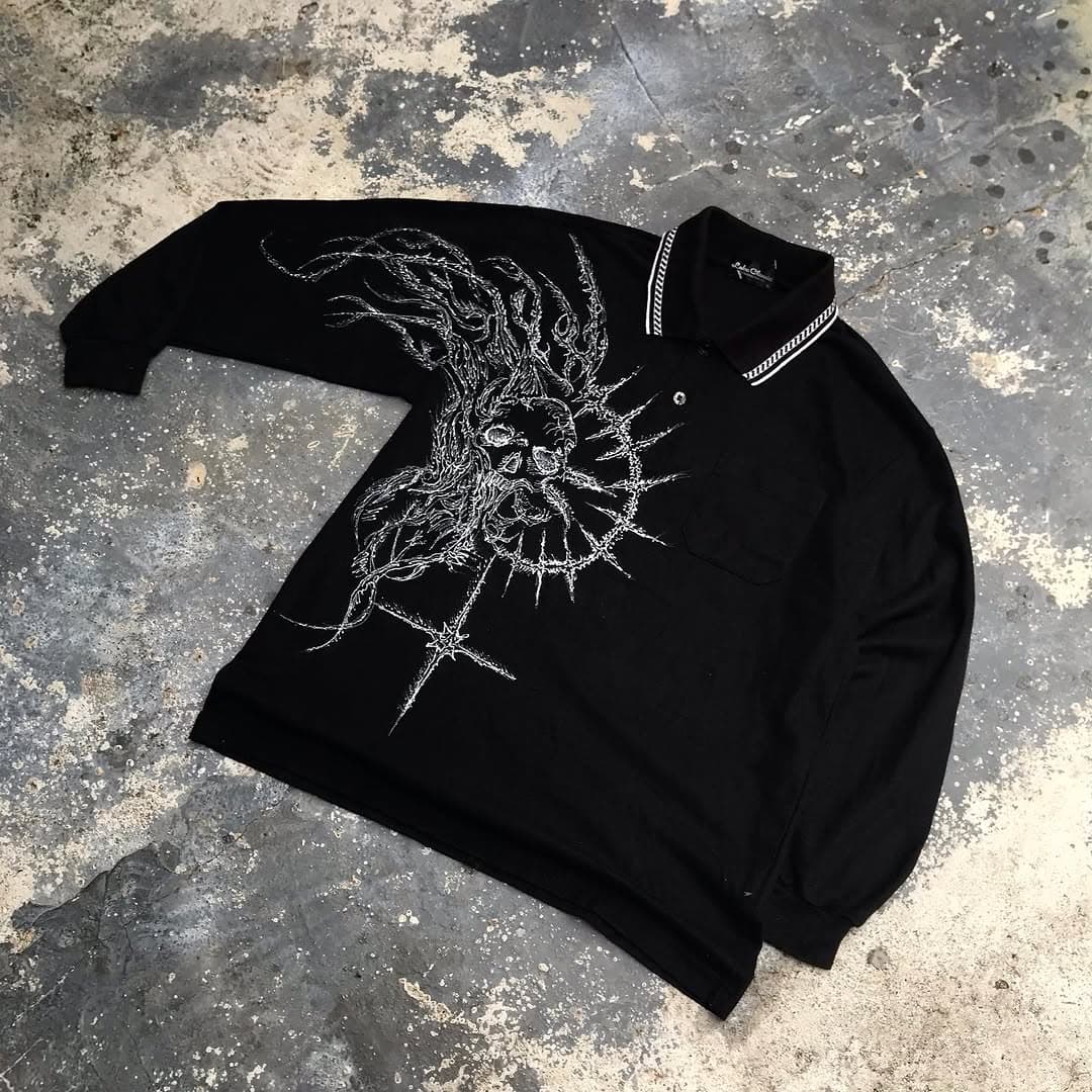 FOUNDED hand-painted polo on concrete